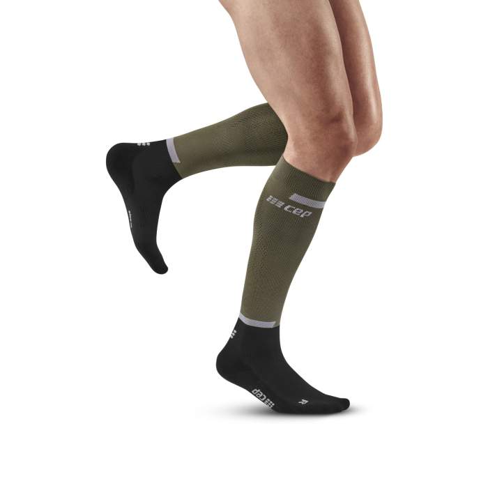https://keypowersports.sg/cdn/shop/products/cep-the-run-socks-tall-men-olive-black-wp30rr-front-model-web_1.jpg?v=1675667472